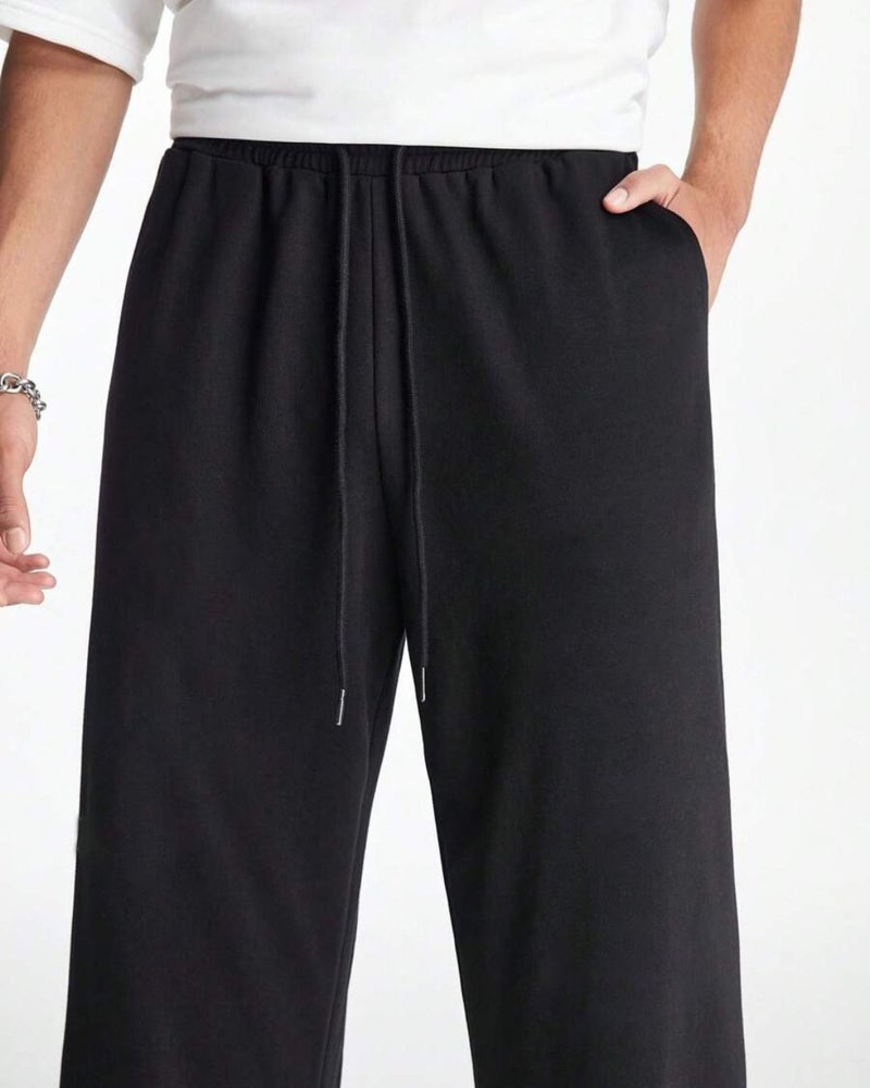 فلاينوف بنطلون رياضي رجالي أسود سادة بقصة فضفاضة - Image 3